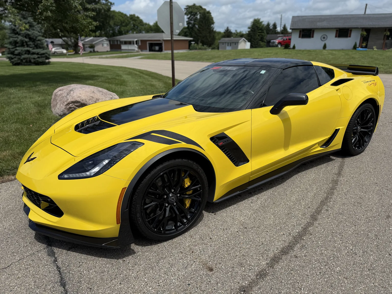 A freshly detailed yellow Corvette gleaming after a Wax N' Go service